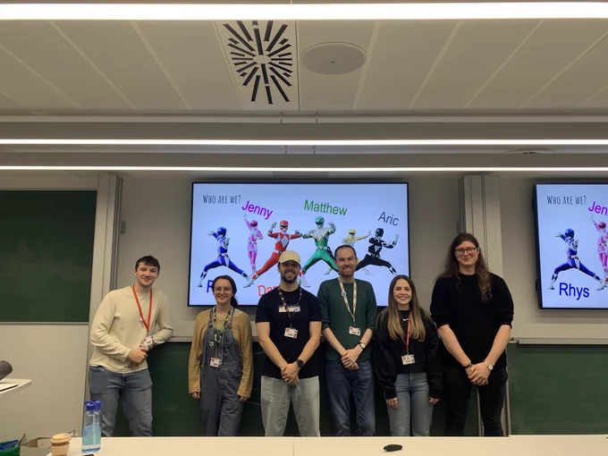 Our presenters posing for a photo after the talk. Left to right; Rhys, Jenny, Daniel, Matthew, Elin, Aric.