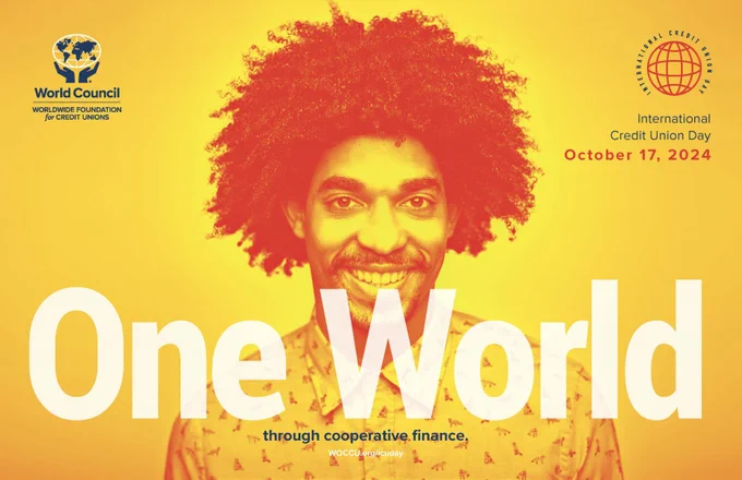 A head shot of a man smiling. The upper left corner has the World Council of Credit Unions logo and the upper right corner has the International Credit Union Day logo.  The bottom has descriptive text: One world through cooperative finance.