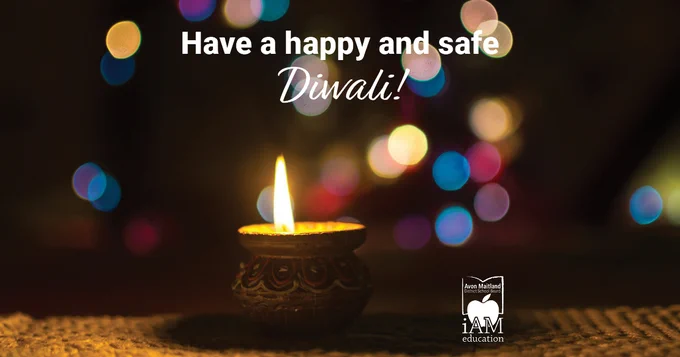 Image of a candle in a small decorative clay pot with blurred circles of light in the background. Text: Have a happy and safe Diwali. AMDSB logo.