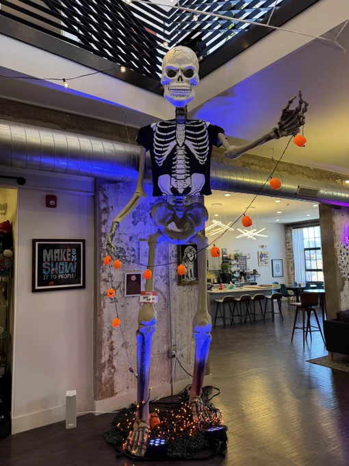 A 12 foot skeleton wearing a skeleton mask and a skeleton t shirt