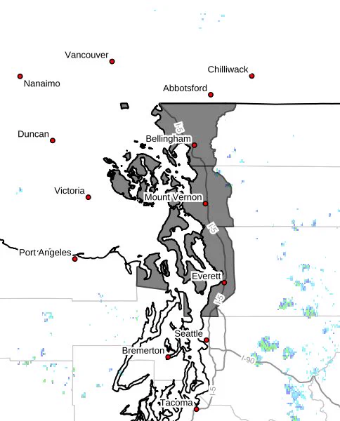 A map of western Washington state with areas affected by a wind advisory highlighted in gray. Key cities are denoted by red dots.