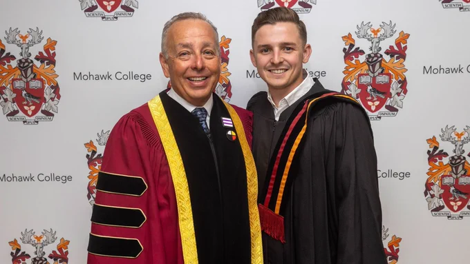 Ben with President Paul Armstrong, both smiling at the camera. 
