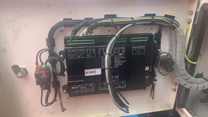 An image of the vandalised pump control panel, which has had its wires cut.