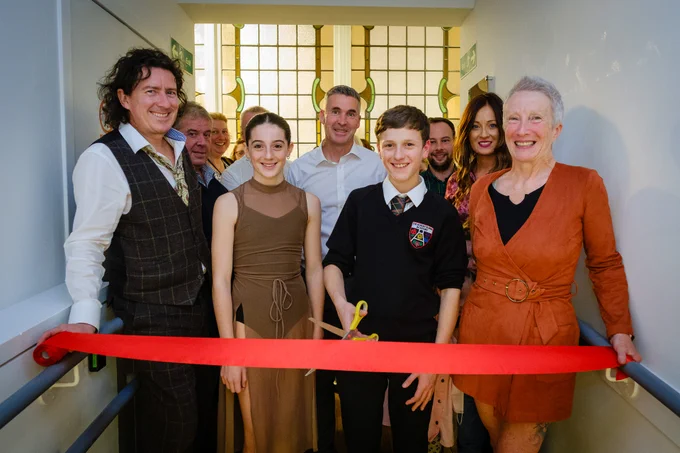 Alice from Grange Academy and Adam from The Robert Burns Academy officially open Remembering Together: Tales from the Tipi by cutting a ribbon. They are joined by Councillor Graham Barton, the Creative Minds team and the Lead Artists. 