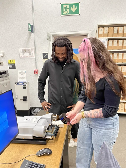 Two LAC employees using the microform reader.