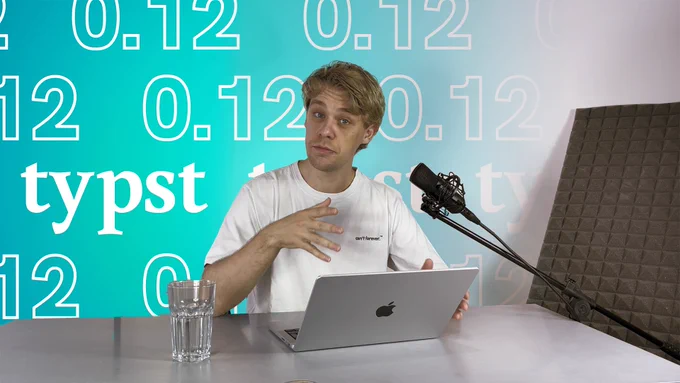 Man with a notebook in front of a grafic saying Typst 0.12
