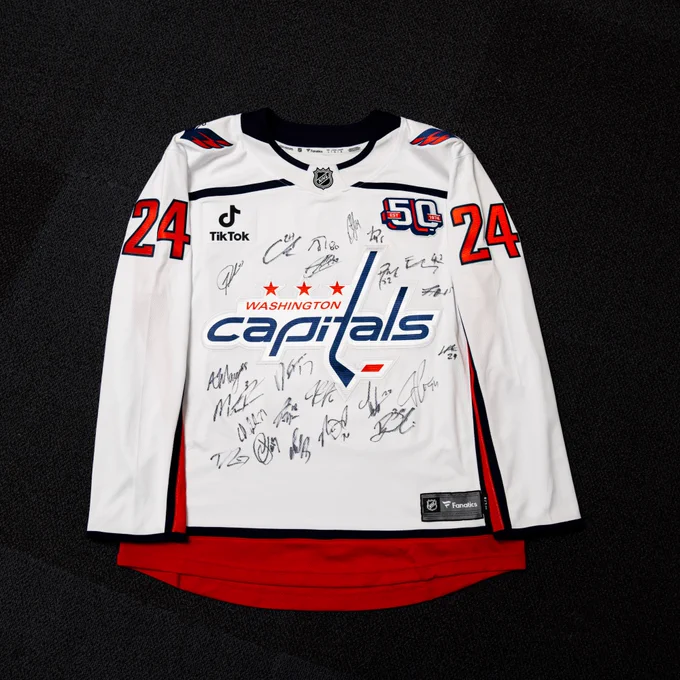 A photo of a replica team-signed Fanatics away jersey complete with the number 24, as well as 50th anniversary and TikTok patches.