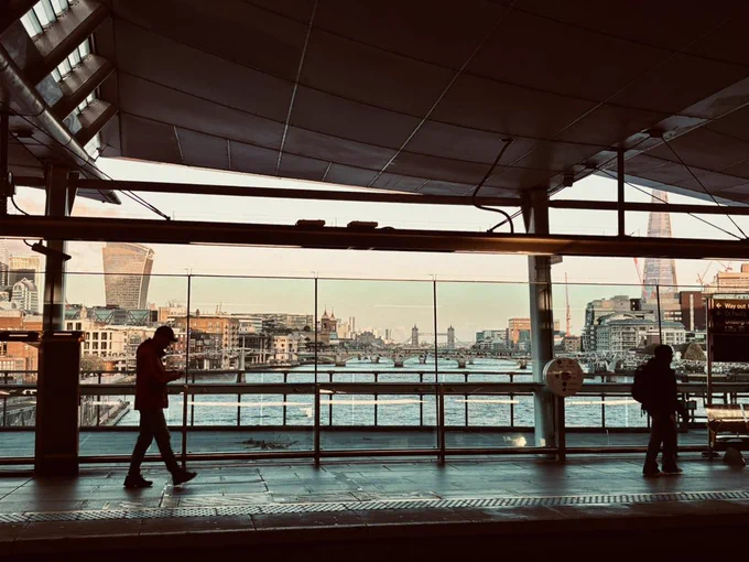 The view from the train platform at London Blackfriars station of the River Thames, Tower Bridge in the distance.
