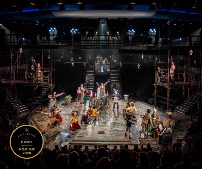 The company of Oliver on the stage