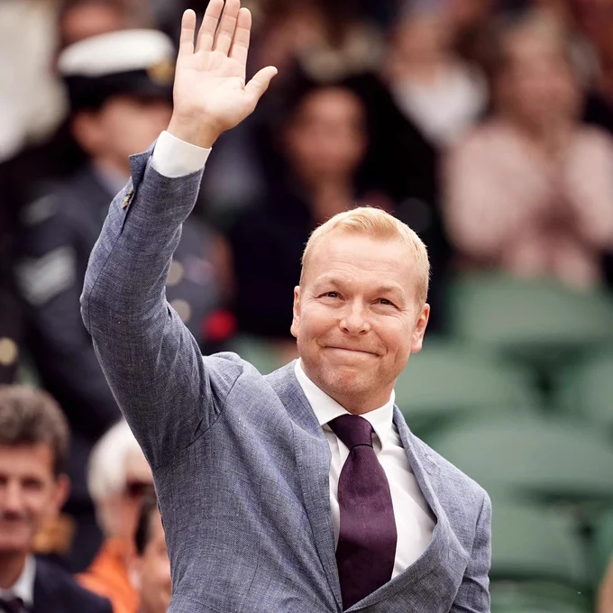 Sir Chris Hoy waves hand at Wimbledon.