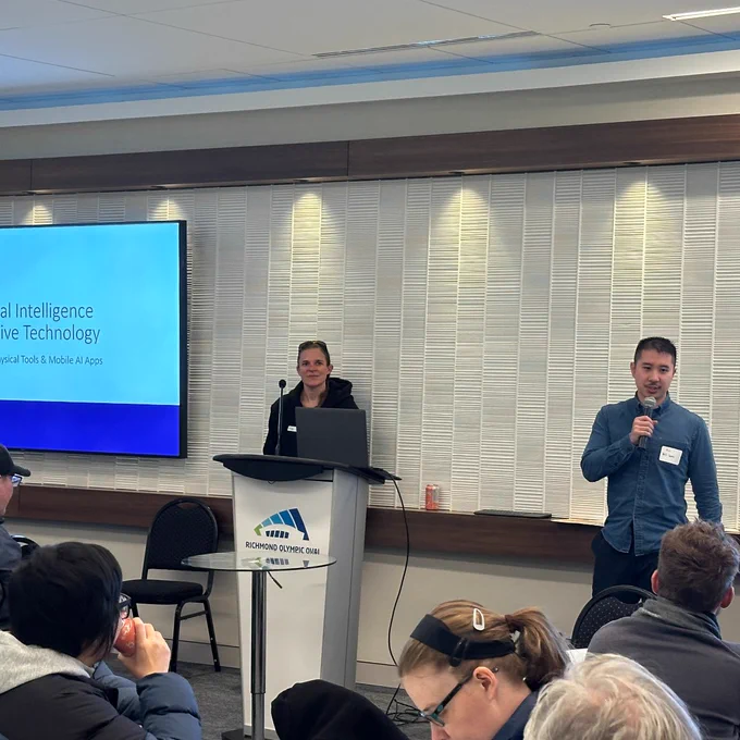 Jody and Eric presenting on AI and assistive technology at the event.