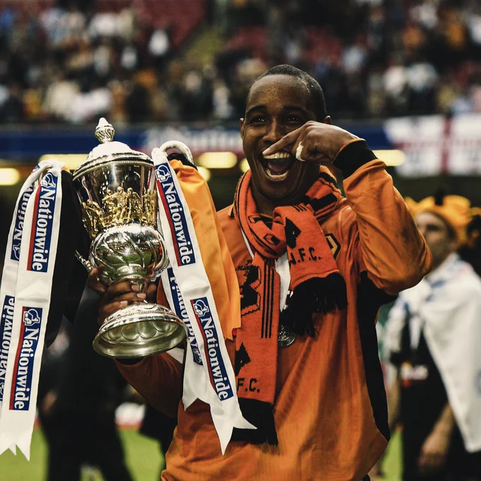 Paul Ince celebrates with a trophy after winning the play-offs with Wolves in 2003.