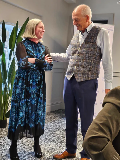 Mervyn McCall speaking with guest at CFNI's Philanthropy Network event