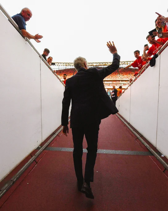An image of Arsene Wenger walking out the tunnel at Emirates Stadium.