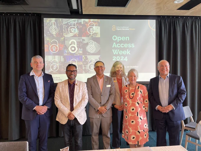 Panel members standing in front a of a screen that says Open Access Week 2024. People standing are Professor Timothy Cavagnaro, Professor Raj Shekhawat, Prashant Pandey, Liz Walkley Hall, Professor Sharyn Roach Anleu and Professor Vincent Bulone.