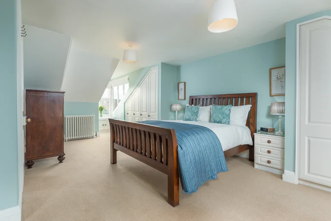 Spacious bedroom at Heron House, luxury riverside accommodation in Warkworth