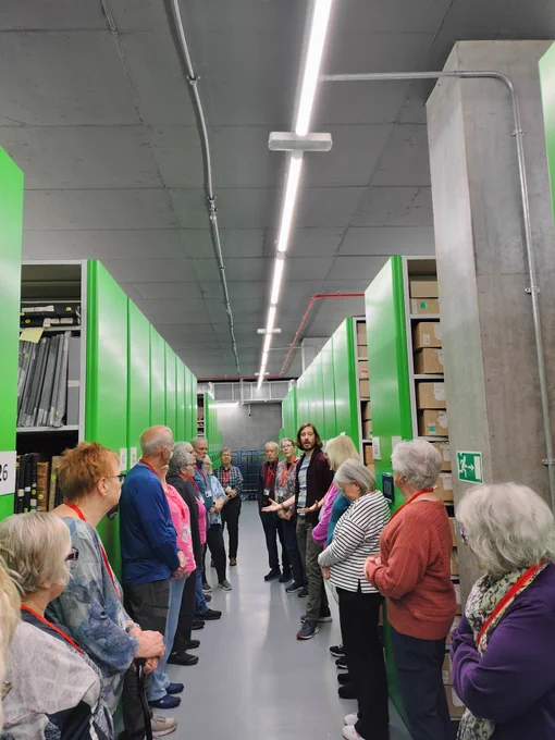 Photograph of a group of UHF delegates in the PRONI stores.