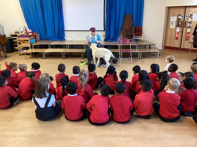 Uri at front of a school assembly 