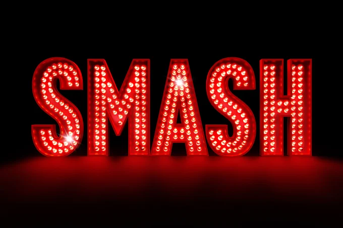 A photo showing the artwork displaying the word "SMASH" in red-lit laterrs 