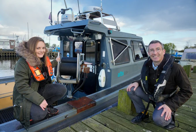 AFBI Freshwater scientist, Faye Shiels with DAERA Minister Andrew Muir pictured at the handover of the research vessel SALAR in Ballyronan Marina.