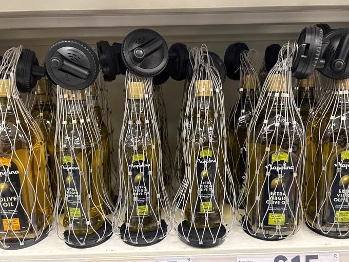 Photo of security tagged olive oil. 