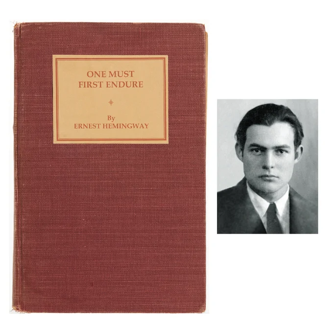 A red clothbound book with a cream-colored title plate that reads, in red letters: “One Must First Endure / by Ernest Hemingway”. Next to the book is a black and white photograph of Ernest Hemingway