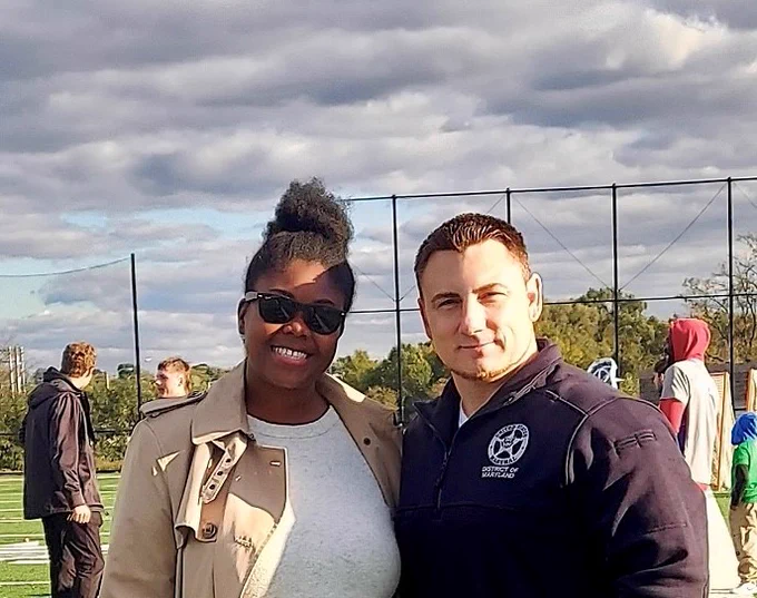 Courtney from the Cal Ripken Sr. Foundation poses for a photo with a Deputy U.S. Marshal.