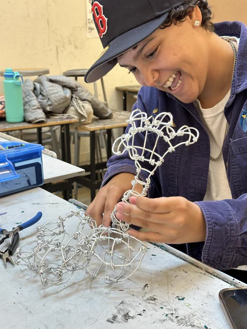 Student working on a wire sculpture.