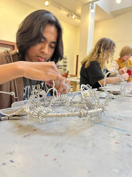 Student working on a wire sculpture.