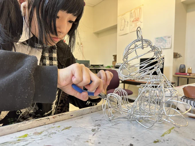 Student working on a wire sculpture.