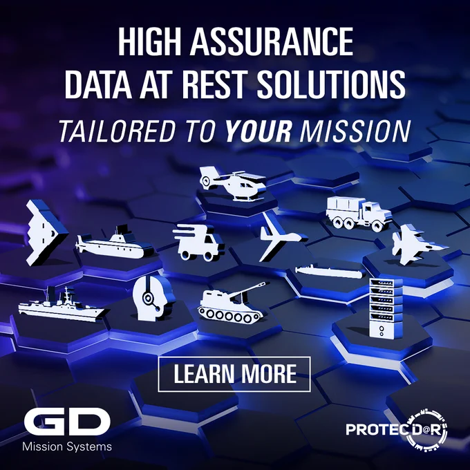 Promotional graphic for General Dynamics Mission Systems featuring various military and transportation vehicles, denoting their high assurance data at rest solutions with a call-to-action button labeled "Learn More". The background is a digital blue grid.
