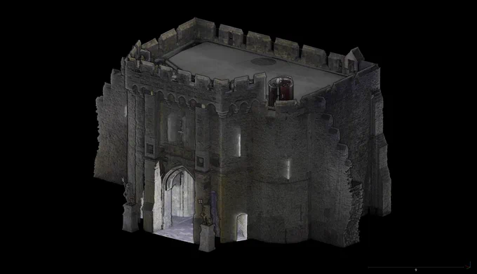 A detailed 3D scan of the front of Bargate in Southampton, showing its medieval stone facade. The structure includes arched entrances, crenellated battlements, and walls with visible stone textures. A cylindrical object, possibly a chimney or lookout structure, is located on the roof. 
Credit: University of Southampton & Southampton City Council.