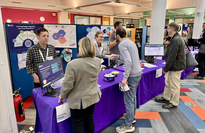 Some of the #OU_LD team chatting with visitors to the #LearningDesign stand.