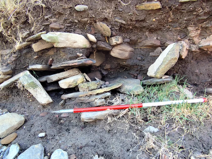 A newly discovered eroding structure and midden near Whitehall which could be prehistoric.