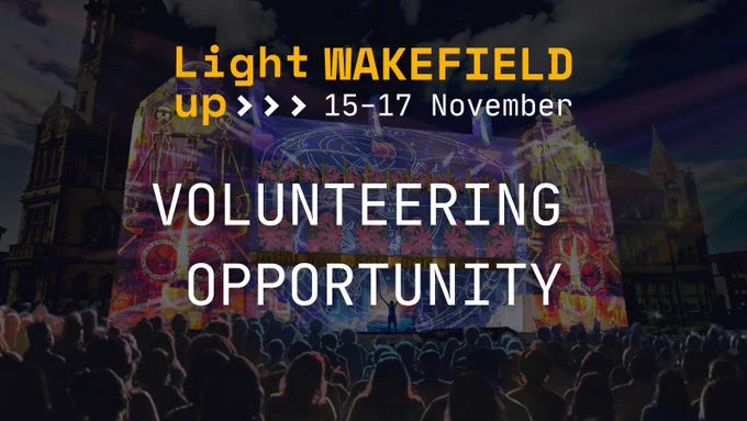 The Timekeepers by Illuminos in the background with text: Light Up Wakefield 15-17 November. Volunteering Opportunity