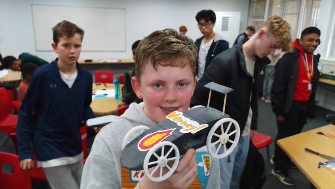 Student showing off his rocket car 