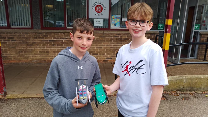 Students showing off rocket cars