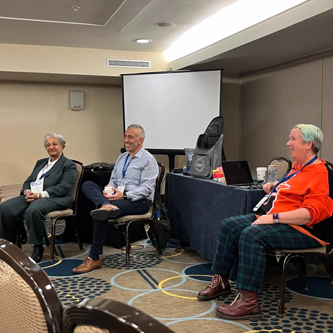 Professors Khaldoun Abou Assi, Jessica Sowa from U Delaware and Lois Warner from Rutgers U, sitting on a panel, smiling.