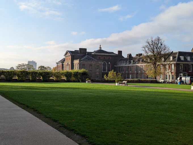 Side view of Kensington Palace and the green lawn in front of it
