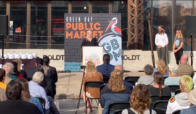 DOA Assistant Deputy Secretary Diana Maas addresses a crowd gathered to break ground on the new Green Bay Public Market. 