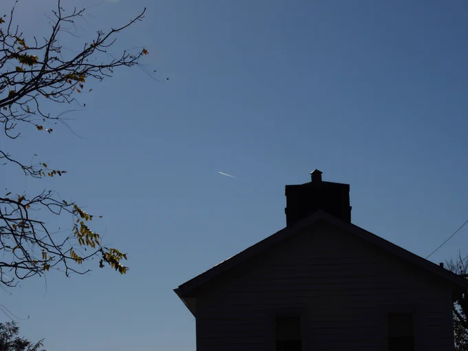 Unzoomed photo of one of frequent chemtrailers, which are spraying quickly disappearing chemtrail mixture (see zoomed).