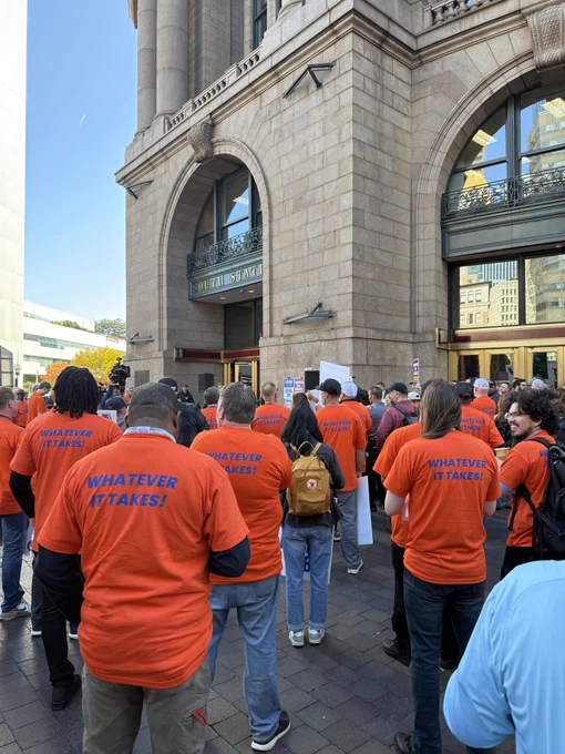 A photo of Machinists Union Local 318 members at a rail labor rally.