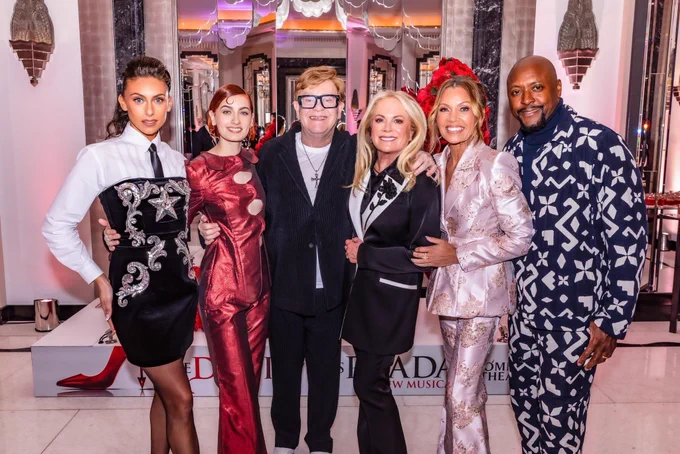 Cast of The Devil Wears Prada alongside Sir Elton John
