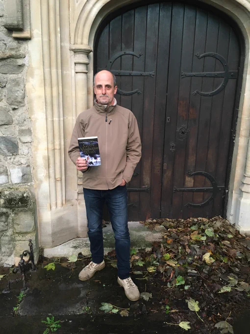 Charles Cordell outside St Nicholas' Church, Chiswick, where his debut English Civil War novel God's Vindictive Wrath ends.