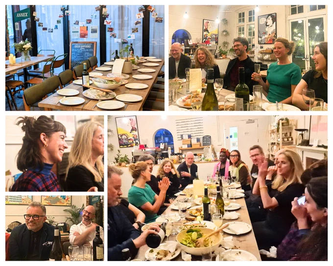 Dinner table of joyful conversations in an intimate cafe-dinner setting.