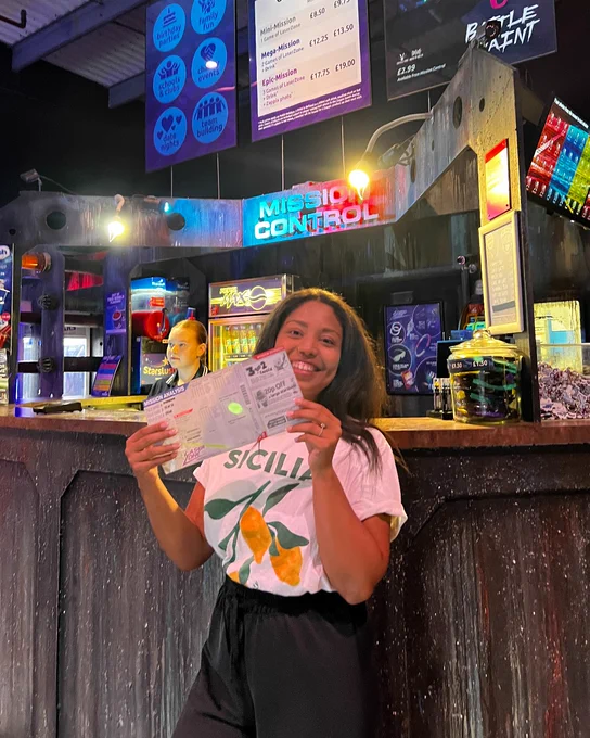 Person holding tickets at the Laserzone bar