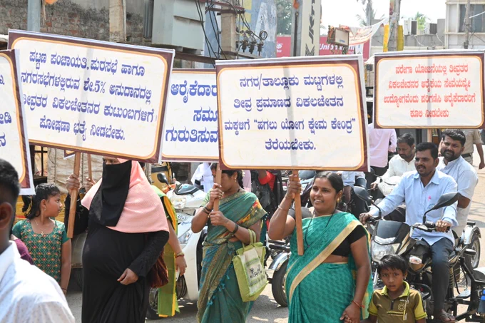 Large group of people holding a rally in the street
