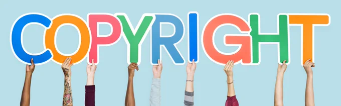 The hands of diverse individuals hold up large, colorful letters spelling "COPYRIGHT" against a light blue background. Each letter features a different bright color, creating a vibrant and playful display.