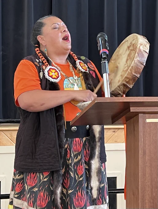Kim Wheatley singing during the smudging ceremony