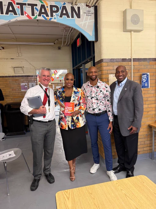 Rep. Ayanna Pressley poses for a photo with Boston International Newcomers Academy leaders & educators. 